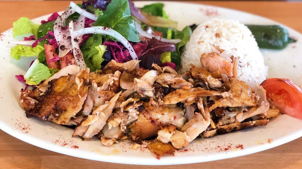 Chicken Gyro · Layers of marinated chicken thighs wrapped around the vertical split, grilled in front of vertical ﬁre served with rice and mixed green salad.