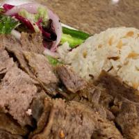 Lamb Gyro · Thinly sliced marinated lamb and beef, grilled on spinning vertical split grill.