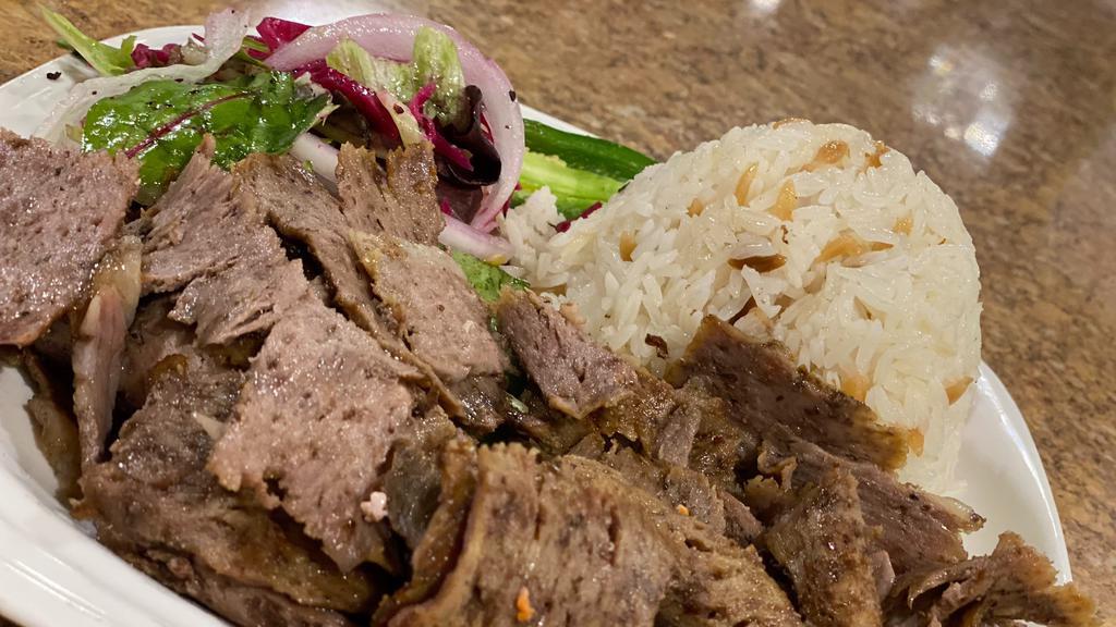 Lamb Gyro · Thinly sliced marinated lamb and beef, grilled on spinning vertical split grill.