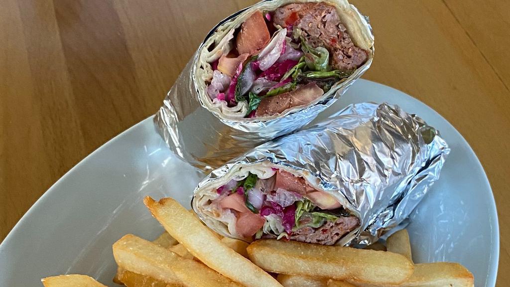 Adana Wrap · Grilled ground lamb with lettuce, tomatoes and onions.