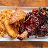 Beef Short Ribs · Succulent beef short ribs with our house special BBQ sauce.