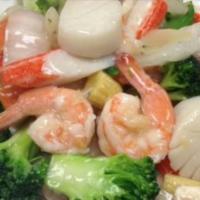 Seafood Delight · Lobster meat, scallop, crab stick and shrimp with fresh vegetables in white sauce.