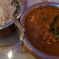Curry · Your choice of meat tandoori prepared and served with tomato based gravy.