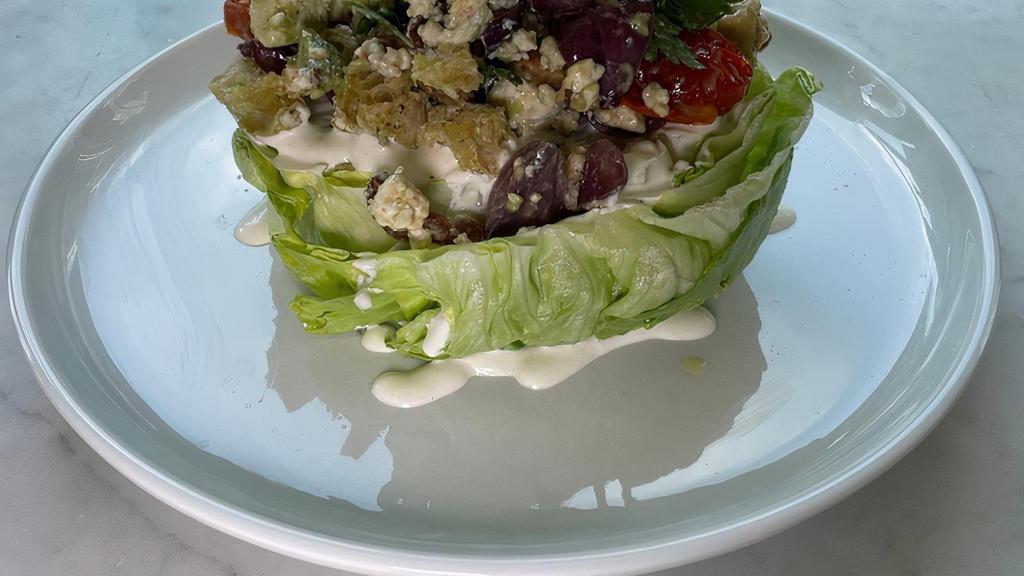 Wedge Salad · tomato, bacon, avocado, pickled onions, blue cheese, croutons