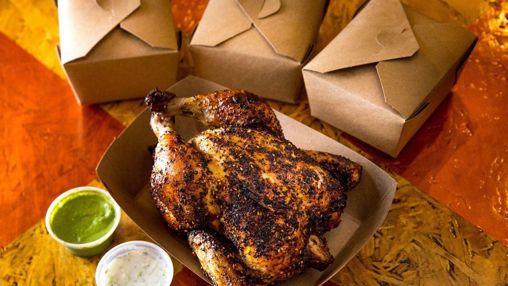 Combo #3 · Whole chicken, your choice of two sides, dipping sauce, and homemade cornbread.