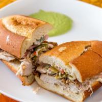 Chicken Sandwich · Your choice of rotisserie white or dark meat, pickled peppers, and black pepper mayo on a fr...