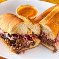 Short Rib Sandwich · Slow cooked beef short ribs with coleslaw on a fresh Italian roll.served w/potatoes