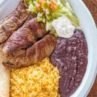 Carne Asada · Grilled steak. Served with rice, beans, pico de gallo, salad and tortillas.