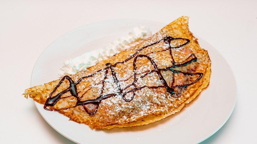 Banana, Strawberry & Nutella Crepe · Crepe stuffed with freshly diced bananas, strawberries and Nutella. Comes with whipped cream, chocolate syrup and powdered sugar on top.