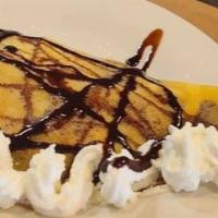 Baked Apple Filling, Nutella & Cinnamon Crepe · Crepe stuffed with baked apple cinnamon filling and Nutella. Comes with whipped cream, choco...