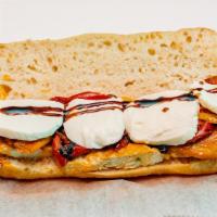 Grilled Chicken Panini · Grilled chicken, fresh mozzarella, roasted peppers and mixed greens.
