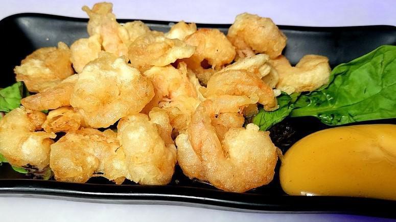 Rock Shrimp · Florida rock shrimp, flash-tempura fried, tossed in creamy spicy glaze.