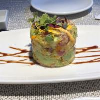 Tuna Tower · Glistening tuna, ripe avocado and tobiko flying fish roe in savory spicy may sauce. Consumin...