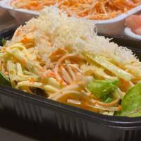 Kani Salad · Shredded crab and cucumber with crunch in a creamy sauce.