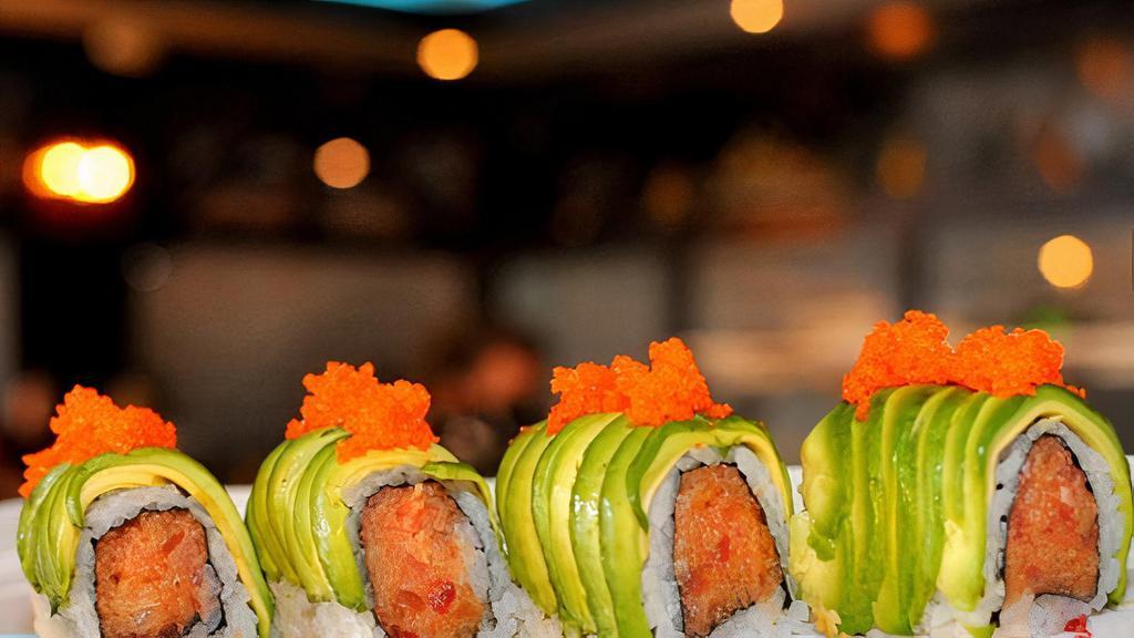 Godzilla Roll · Spicy tuna and crunchies topped generously with avocado in a spicy creamy sauce. Consuming raw or undercooked meats, poultry, seafood shellfish or eggs may increase your risk of foodborne illness.