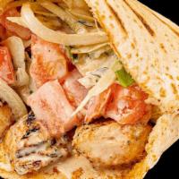 Chicken Kebob Dishes · A salad base topped with two skewers of chicken. Most plates are served with pita bread on t...