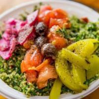 Tabbouleh Dishes · A salad of cracked wheat, parsley, tomatoes, onions, lemon juice, and oil and on a bed of le...