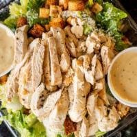Caesar Salad With Chicken · Crisp romaine tossed with croutons, Caesar dressing, and grated cheese.