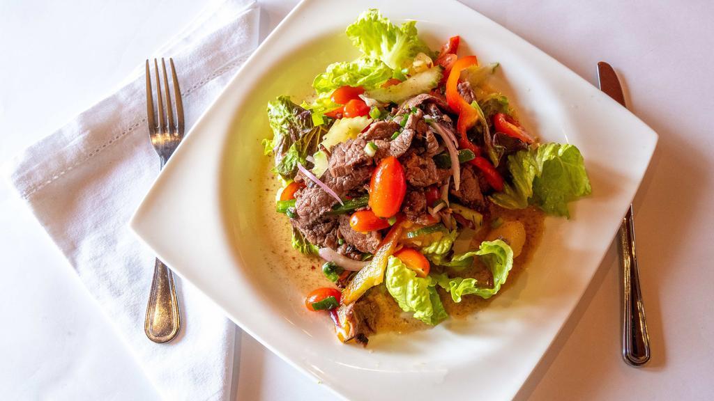 Beef Salad · Grilled beef with pineapple, onions, scallion, carrots, and lime juice.