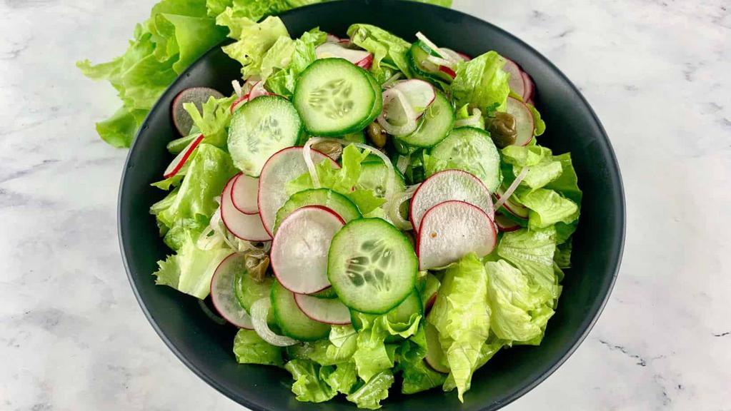 Kale And Romaine Caesar Salad · Pecorino and croutons.