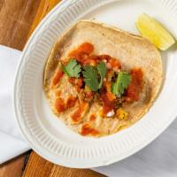 Pulled Pork Taco · Slow cooked for eight hours, topped with charrred pineapple, onion, salsa & cilantro. Gluten...