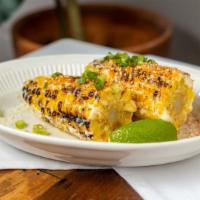 Mexican Street Corn · Grilled corn on the cob with mayo, cotija cheese, chili powder, scallion & lime.  Gluten free.