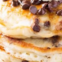 Chocolate Chip Pancakes · Three pieces served with syrup and butter.