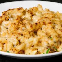 Black Truffle Mac And Cheese · Gemelli pasta mixed with fontina cheese and a creamy cheese sauce which includes black truff...