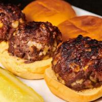 A1 Bacon Cheese Sliders · USDA Prime mini burgers mixed with bacon, Swiss cheese and A1 steak sauce, served on mini po...