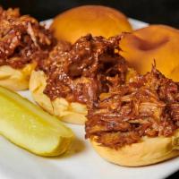 Pulled Pork Sliders · Tender pork, marinated and slow-cooked in Rockwells BBQ sauce, served on mini potato rolls. ...