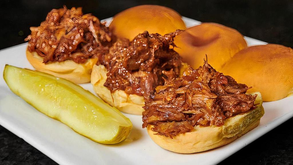 Pulled Pork Sliders · Tender pork, marinated and slow-cooked in Rockwells BBQ sauce, served on mini potato rolls. Mixed with select sauce, vegetable and cheeses. Served with a half pickle.