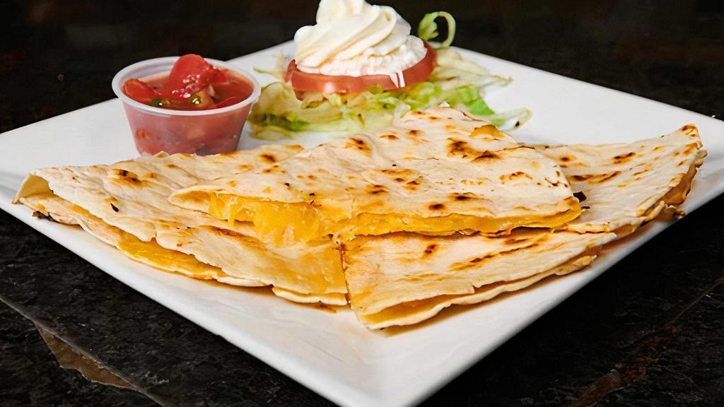Cheese Quesadilla · Filled with Monterey Jack and cheddar cheeses, served with salsa and sour cream.