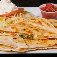 Vegetable Quesadilla · Filled with broccoli, yellow squash, zucchini, onions, carrots, and brie cheese, served with...