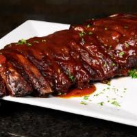 Full Rack Baby Back Ribs · Marinated in Rockwells delicious barbecue sauce and slow oven roasted. Served as the meat if...