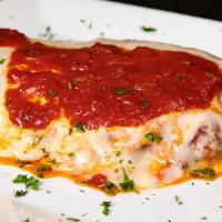 Chicken Parmigiana · Tender breaded chicken breast, topped with marinara sauce and covered with melted mozzarella...