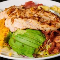 Cobb Salad · Fresh mixed garden greens, topped with choice of protein, bacon, avocado, cheddar cheese, ha...