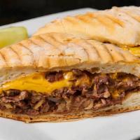 Philly Cheese Steak Sandwich · Thinly sliced prime rib of beef with sauteed onions and melted American cheese.
