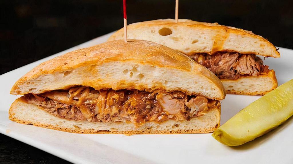 Pulled Pork Sandwich · Tender pork, marinated and slow-cooked in Rockwells BBQ sauce.