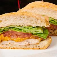 Rockwell'S Chicken Sandwich · Grilled chicken, lettuce, tomato, Monterey Jack, and cheddar cheeses.