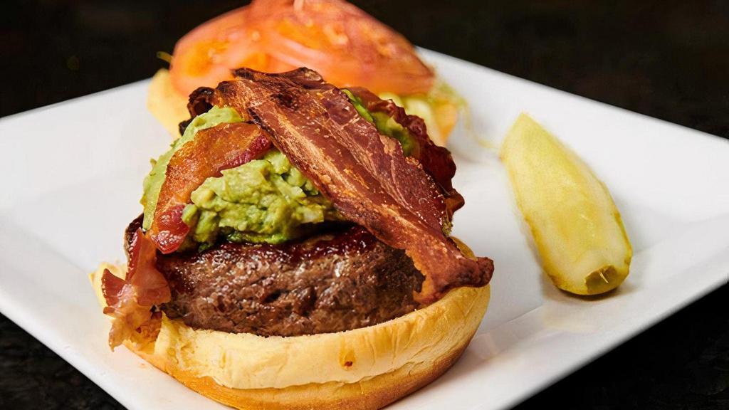 California Burger · Served with bacon, guacamole, lettuce, and tomato. Served with a pickle spear and choice of side.