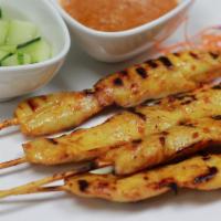 Chicken Satay(4) · Four pieces. Chicken grilled in skewers served with peanut sauce and cucumber.