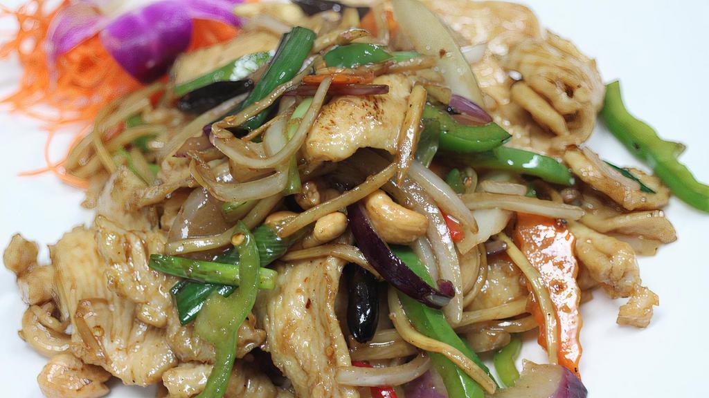 Cashew King · Includes bell peppers, dried chilies, cashew nuts, onions, scallions, carrots, and bamboo shoots. Served with steamed jasmine rice. Spicy.