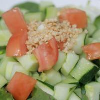 Cucumber Salad · Mixed greens, cucumbers, and tomatoes topped with ground peanuts and ginger vinegar dressing.