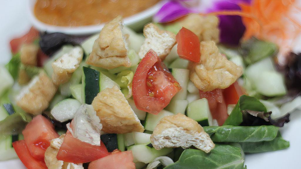 Thai Spring Salad · Mixed greens, tomatoes, cucumbers, and tofu with peanut dressing.