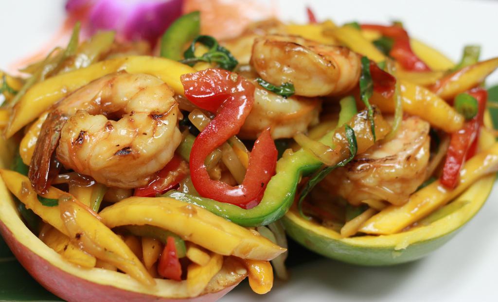 Mango Shrimp · Spicy. Sauteed shrimp, fresh mango, bell pepper, carrot, fresh green chili, basil, and celery with thai spicy mango sauce. Served with steamed jasmine rice. Spicy.