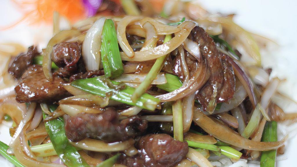Mongolian Beef · Spicy. Sauteed beef with onion and scallion over a bed of crispy noodles. Served with steamed jasmine rice. Spicy.