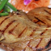 Lemongrass Pork Chop · Grilled thin slices of pork chops marinated with lemongrass, galangal garlic, and lime juice...
