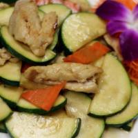 Zucchini Chicken · Sauteed chicken with zucchini and carrots in a light garlic sauce. Served with steamed jasmi...