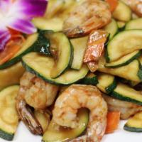 Zucchini Shrimp · Sauteed shrimp with zucchini and carrots in a light garlic sauce. Served with steamed jasmin...