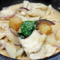 Massaman Curry · Massaman curry with coconut milk, tamarind juice, potatoes, onions, and basil. Served with s...